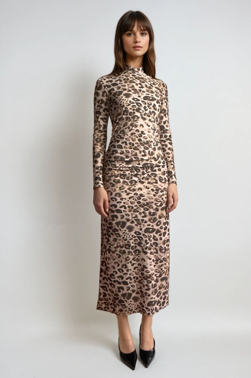 Woman wearing a leopard print dress against a white background